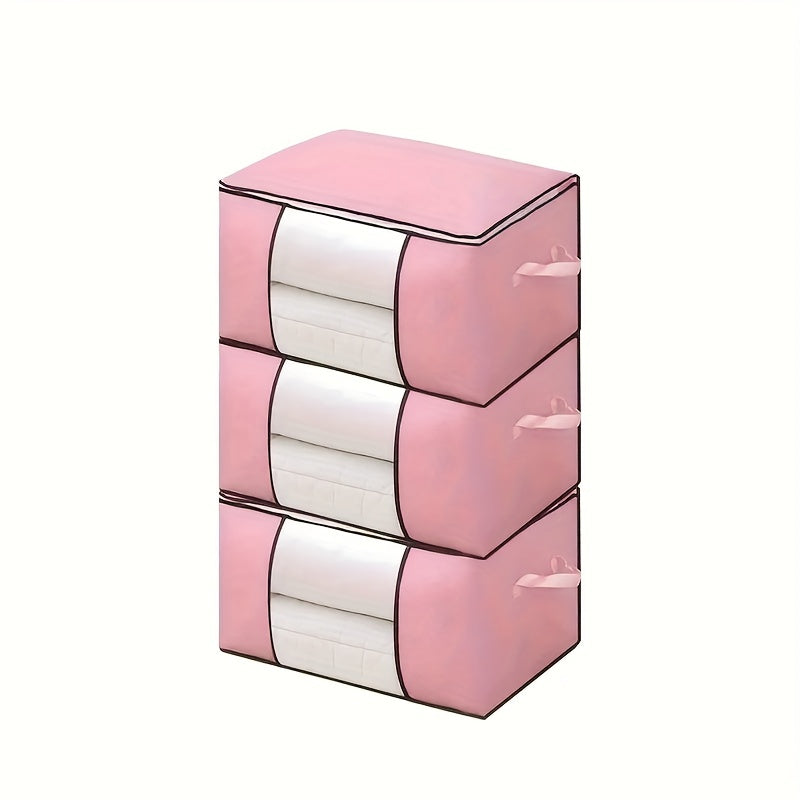 Three 90L storage bags with reinforced handles for organizing clothing, blankets, toys, and bedding in a bedroom wardrobe.