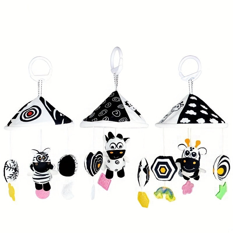 Baby toy car in black and white hanging from the baby trolley, with an umbrella wind chime for early education. The crib bell and stroller hanging umbrella bed bell pendant features black and white animal wind chimes. Additionally, there is a bed hanging