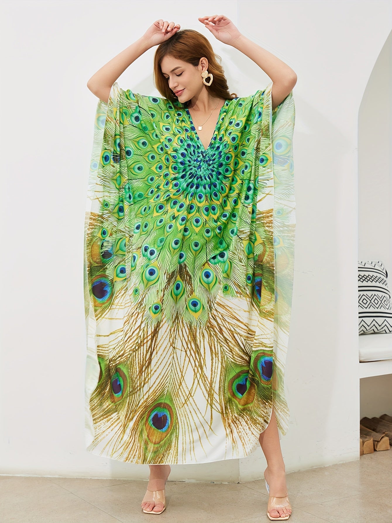 Handmade V-neck maxi beach dress in vibrant green, yellow, and blue peacock print, perfect cover-up for swimwear.