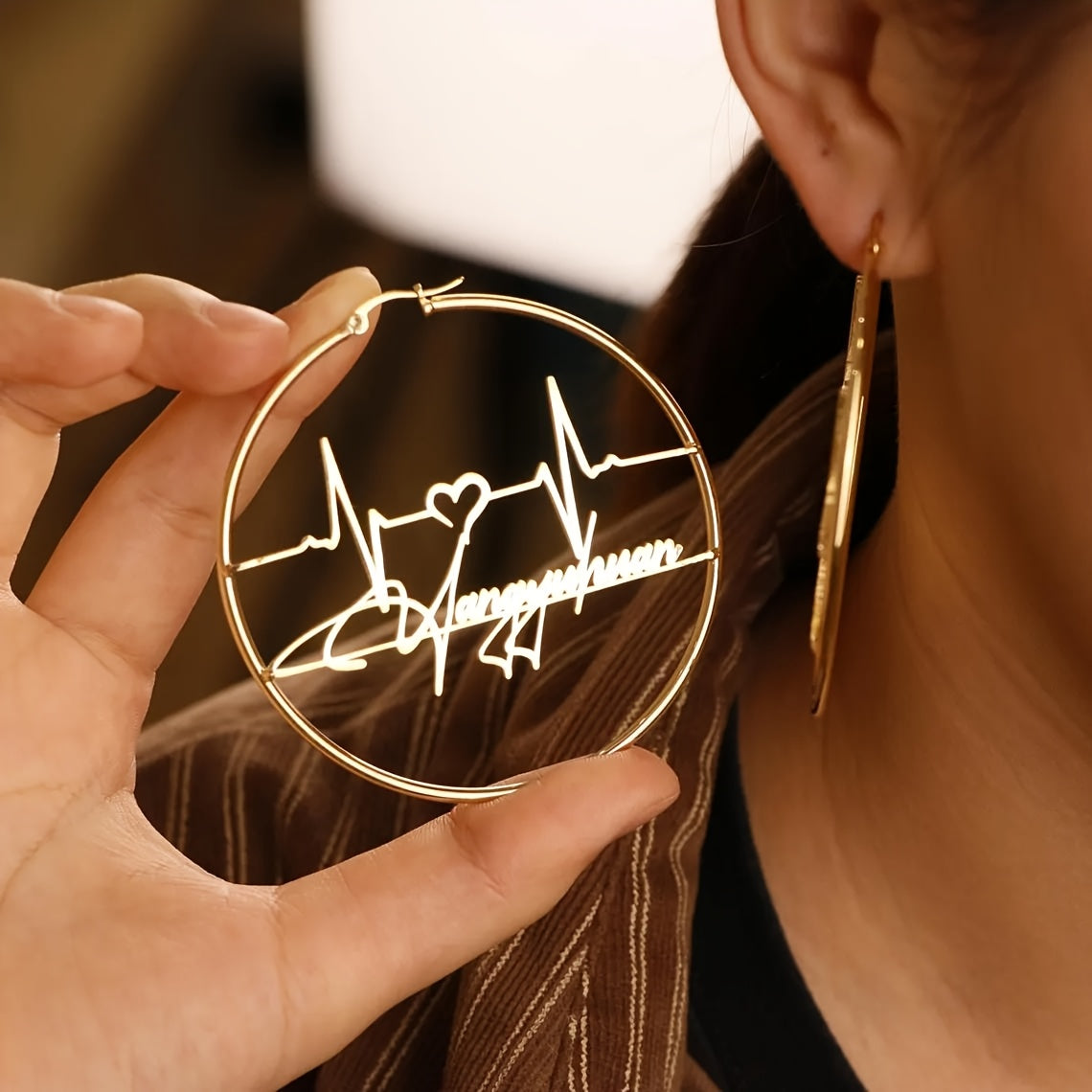 Unique set of personalized heartbeat earrings - Stylish and alluring gold-toned stainless steel hoop earrings measuring 70mm, featuring a custom handwritten design. Perfect for both casual and formal occasions, these trendy earrings are an essential