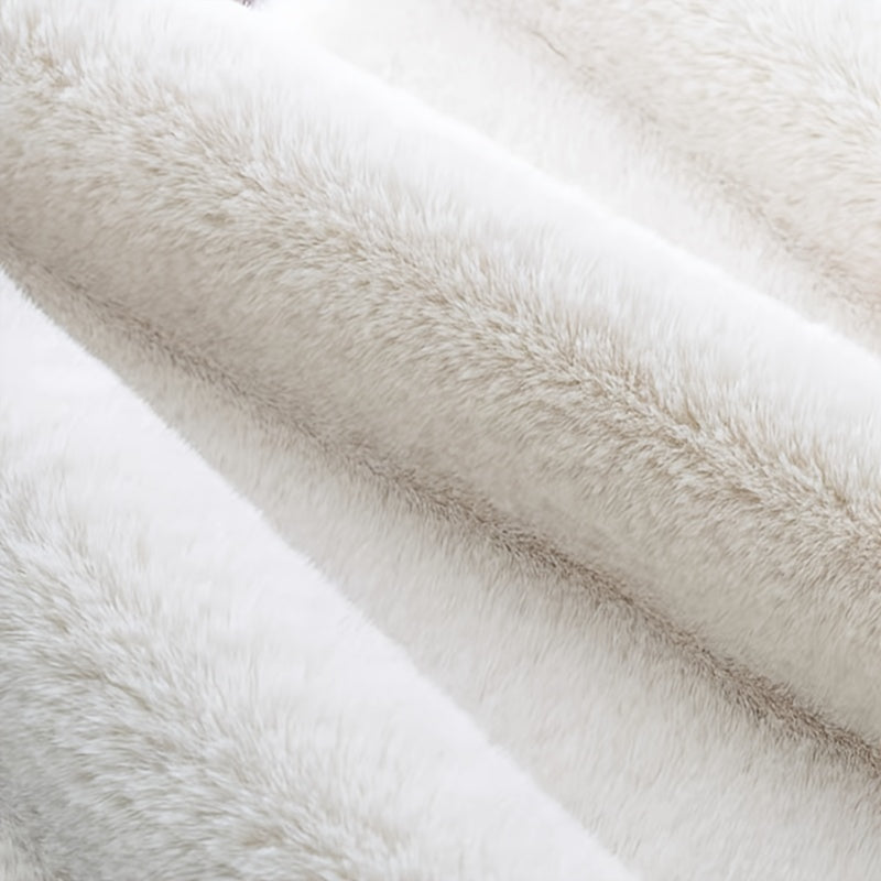 Pamper your space with this gorgeous Faux Rabbit Fur Area Rug, known for its luxurious softness and plush feel. This stain-resistant beauty is perfect for enhancing the decor of your bedroom or living room. Its unique shape adds style to any room, but