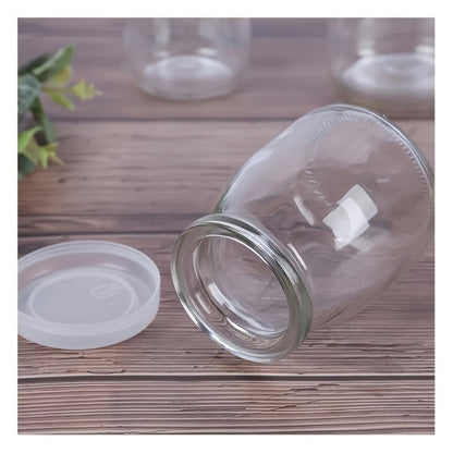 A set of 10 glass Mason jars with flip-top lids, perfect for storing yogurt, pudding, jam, mousse, honey, and more in the kitchen. Each jar holds 4oz and is reusable. These round glass containers are freezer and dishwasher safe, ideal for organizing and