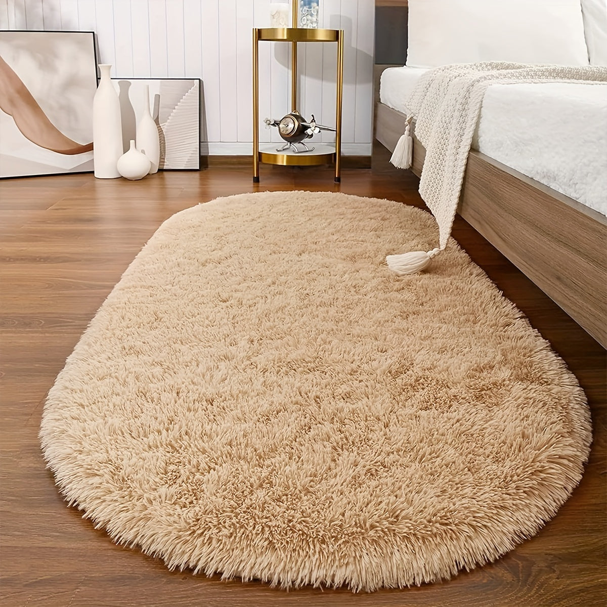 Soft and fluffy oval shaggy area rug, perfect for bedroom or living room. Made with skin-friendly thickened sponge and tufted polyester material. Durable and easy to maintain. Adds decorative touch to indoor spaces such as sofa, bedside, playroom, or