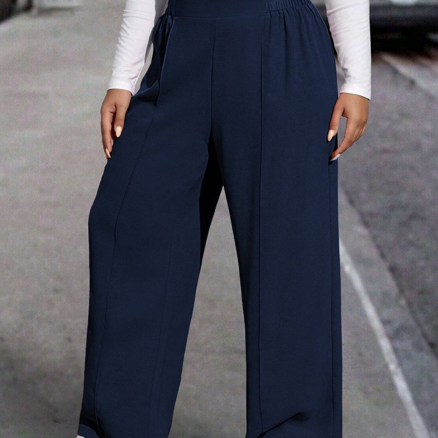 New stylish large women's pants, extended and loose fit, comfortable and light, in a sleek solid color.