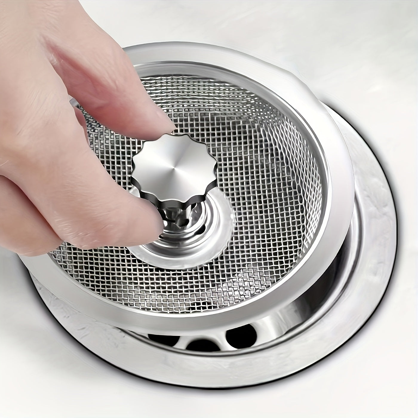 Stainless steel sink strainer for kitchen and bathroom, with 8.13cm and 5.33cm mesh sizes to prevent clogging.