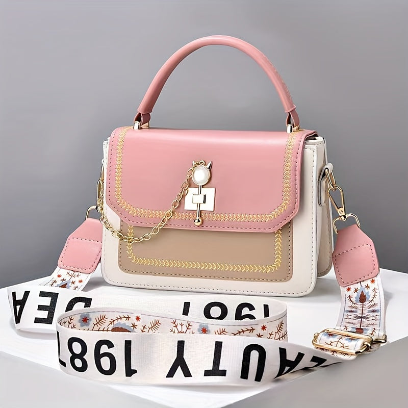 Stylish two-tone women's handbag with adjustable printed strap, made of PU material.