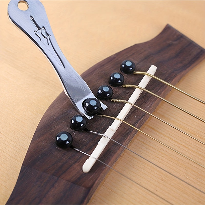 The utility model is a tool for prying, pulling, and removing guitar nails.