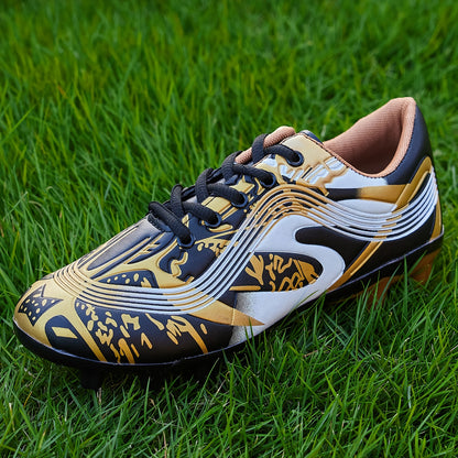 Youth soccer cleats with striped pattern, breathable synthetic upper, and rubber sole for all-season outdoor athletic activities.