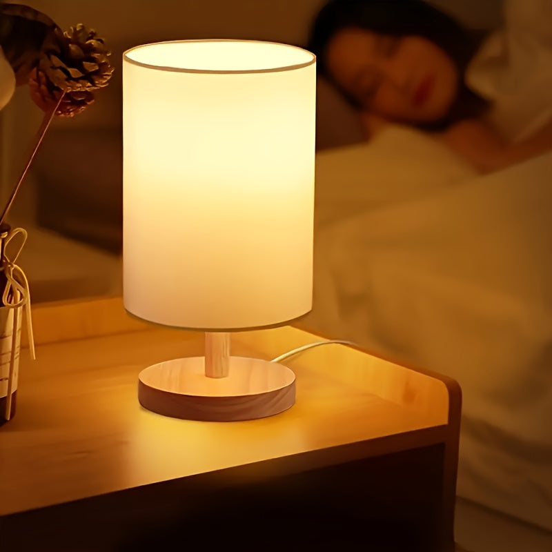 Modern solid wood table lamp with creative LED light, ideal for bedroom, study room, and guest house decor. Features natural wooden base.