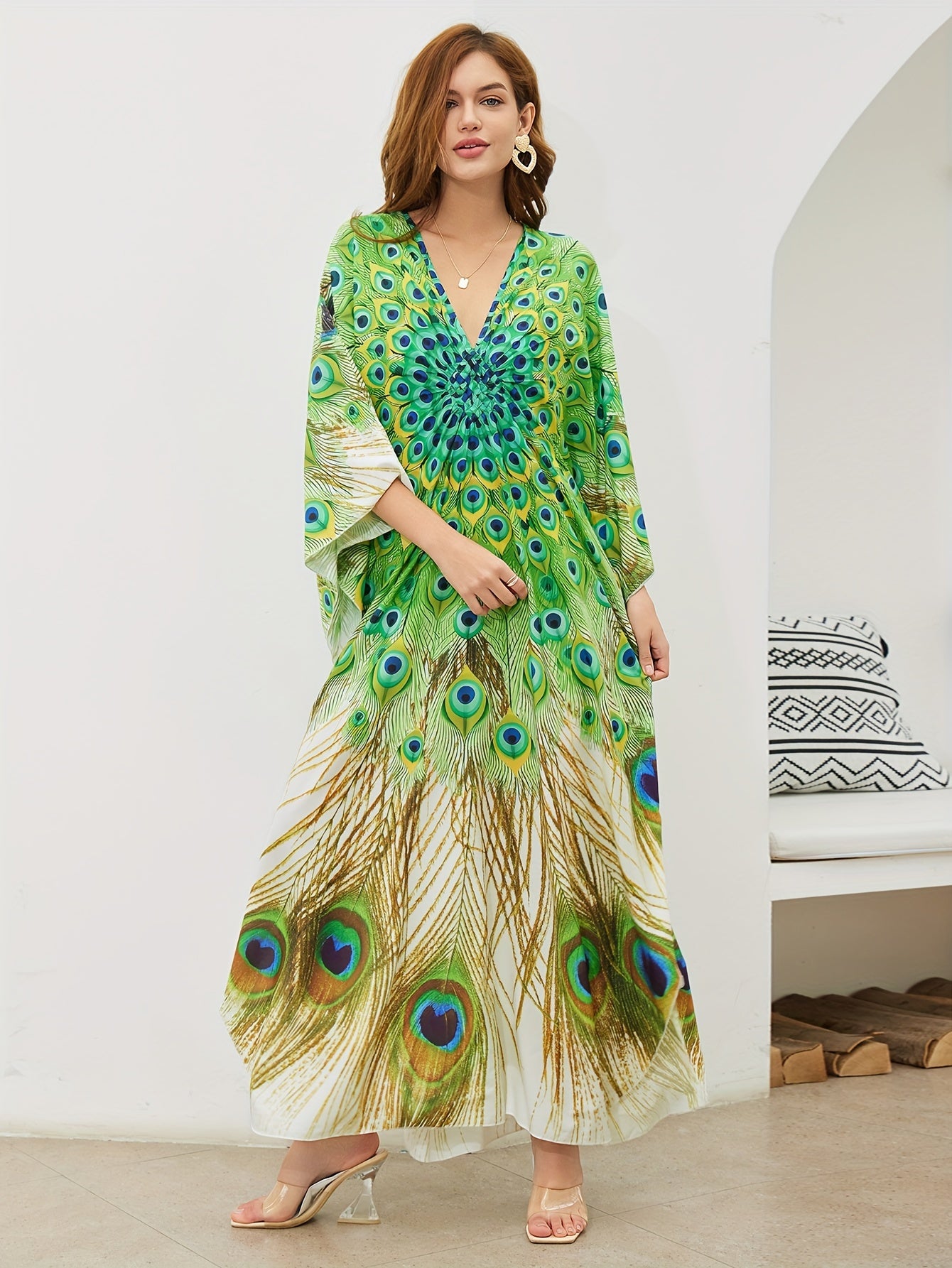 Handmade V-neck maxi beach dress in vibrant green, yellow, and blue peacock print, perfect cover-up for swimwear.