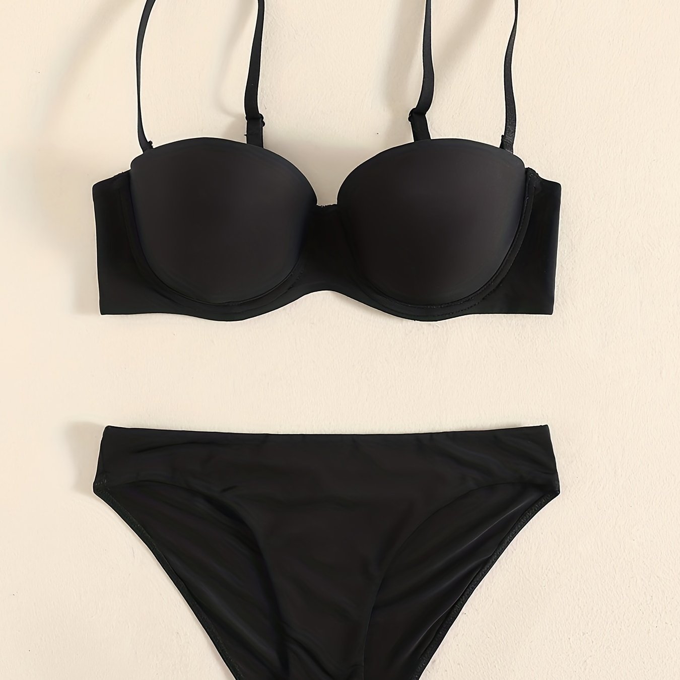 Smooth lingerie set including seamless bra, balconette bra, and bikini panties for women.