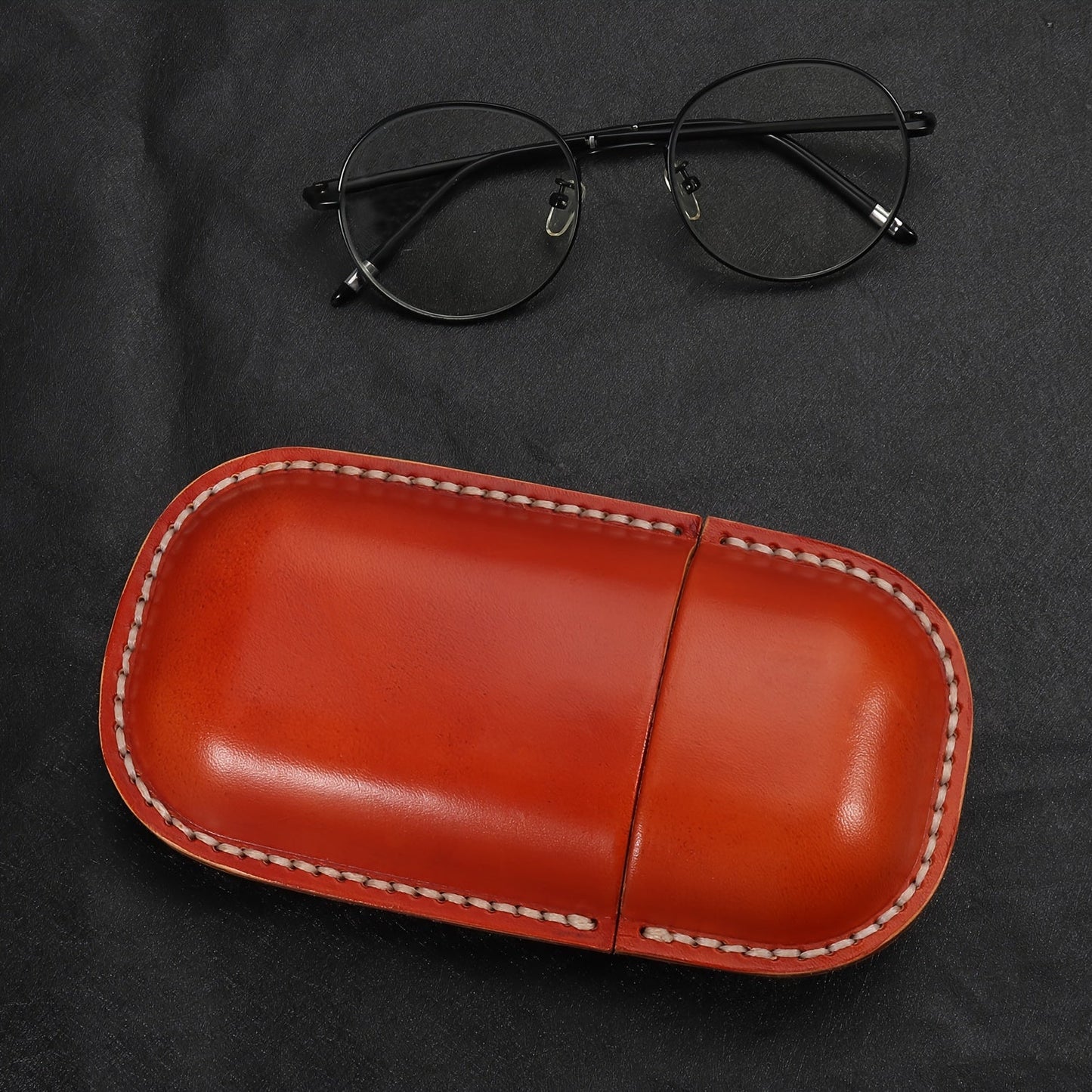 High-quality, stylish faux leather glasses case with retro-inspired design for ultimate protection and storage for your glasses.