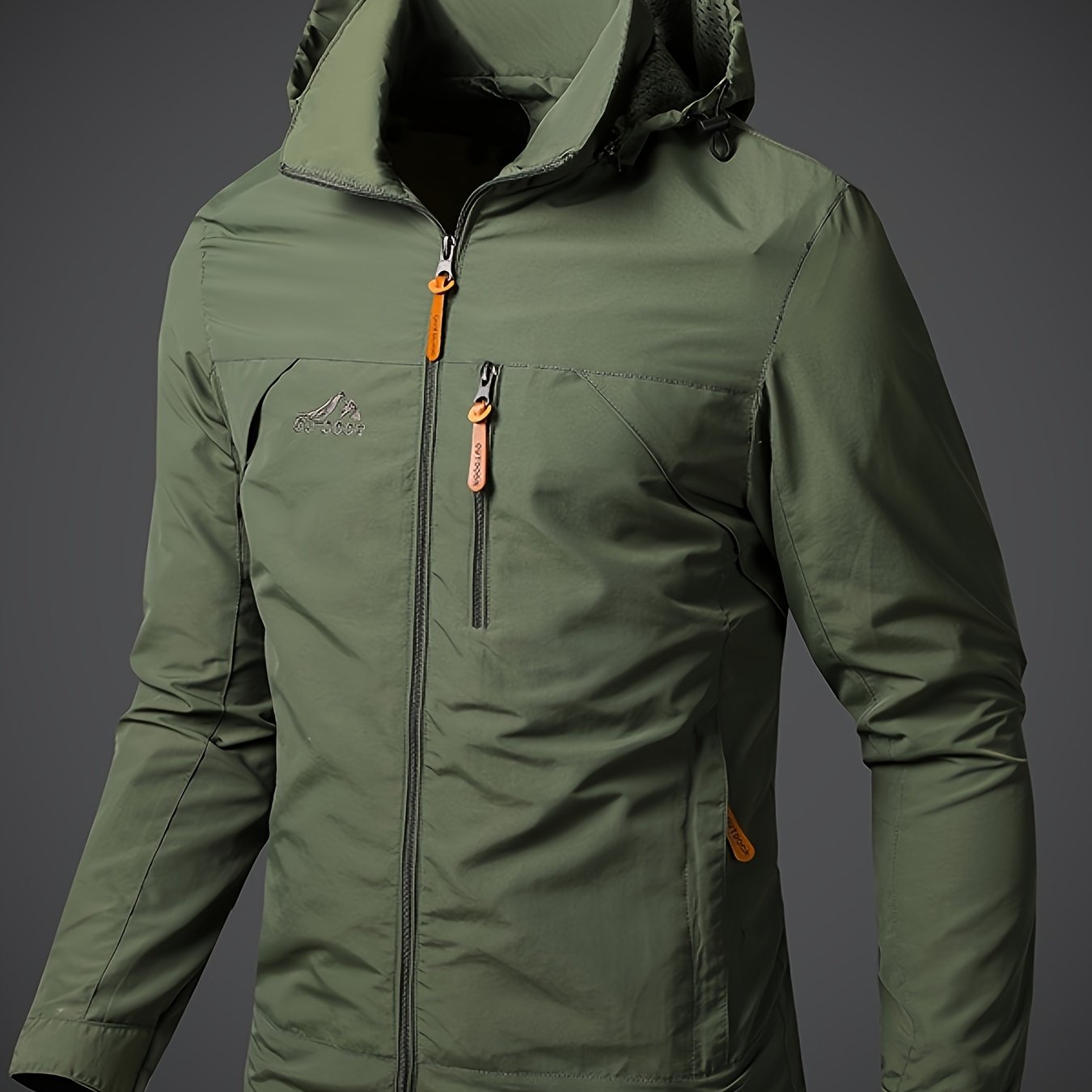 Men's lightweight hooded polyamide jacket with zipper closure and polyester lining, ideal for hiking and outdoor activities in the spring/fall season.