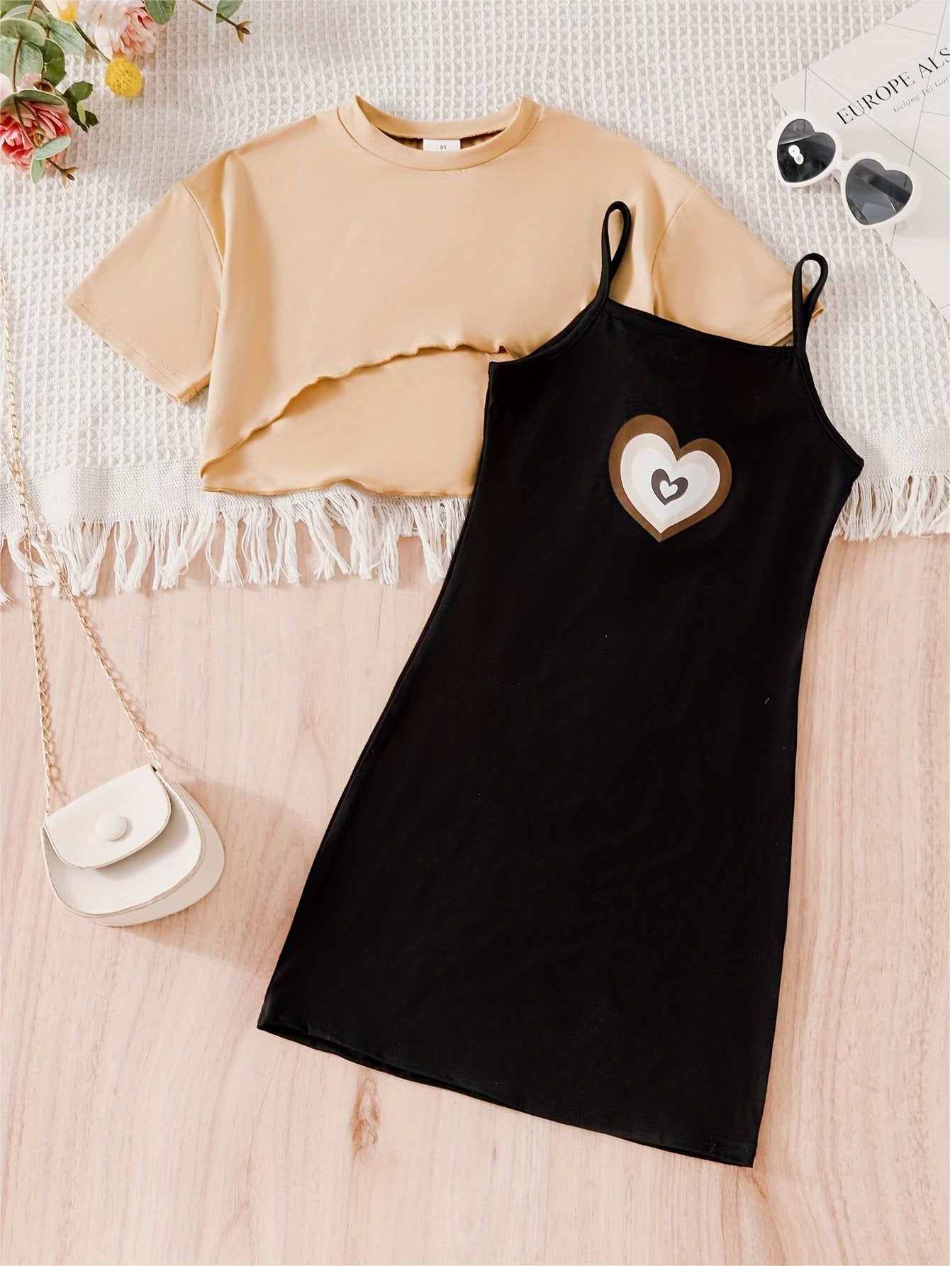 Girls 2-piece casual outfit perfect for outdoor activities, featuring a high low top and heart pattern cami dress.