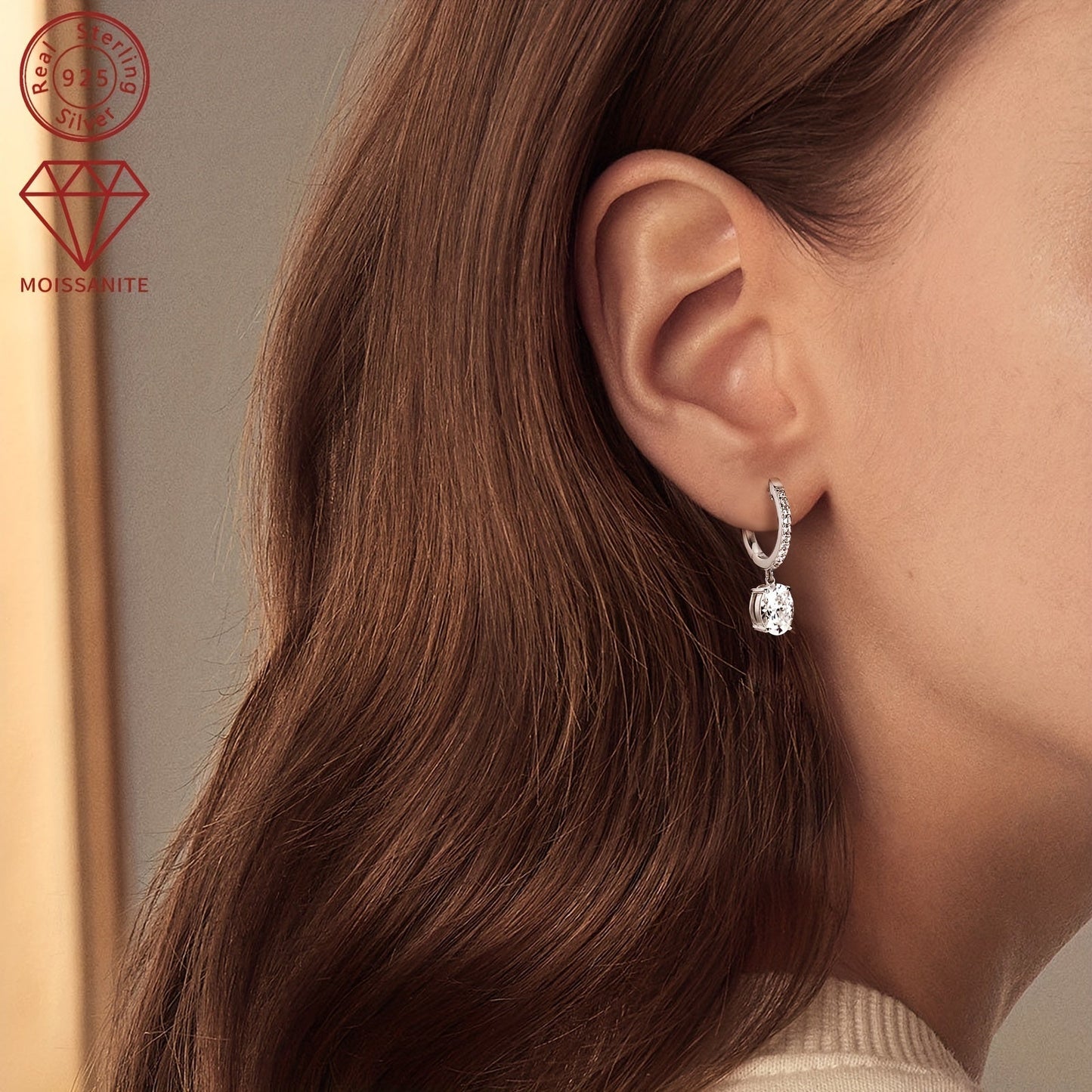 These exquisite silver earrings feature a pair of synthetic moissanite stones, each weighing 1.5ct. The main stones are 6x8mm in size, giving off a dazzling sparkle. These dangling earrings are perfect for adding a touch of glamour to any outfit.