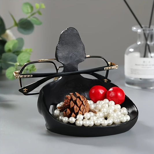 A stylish glasses storage stand made of resin, perfect for organizing and displaying your eyewear collection. This home storage decoration also makes a great gift idea for glasses enthusiasts.