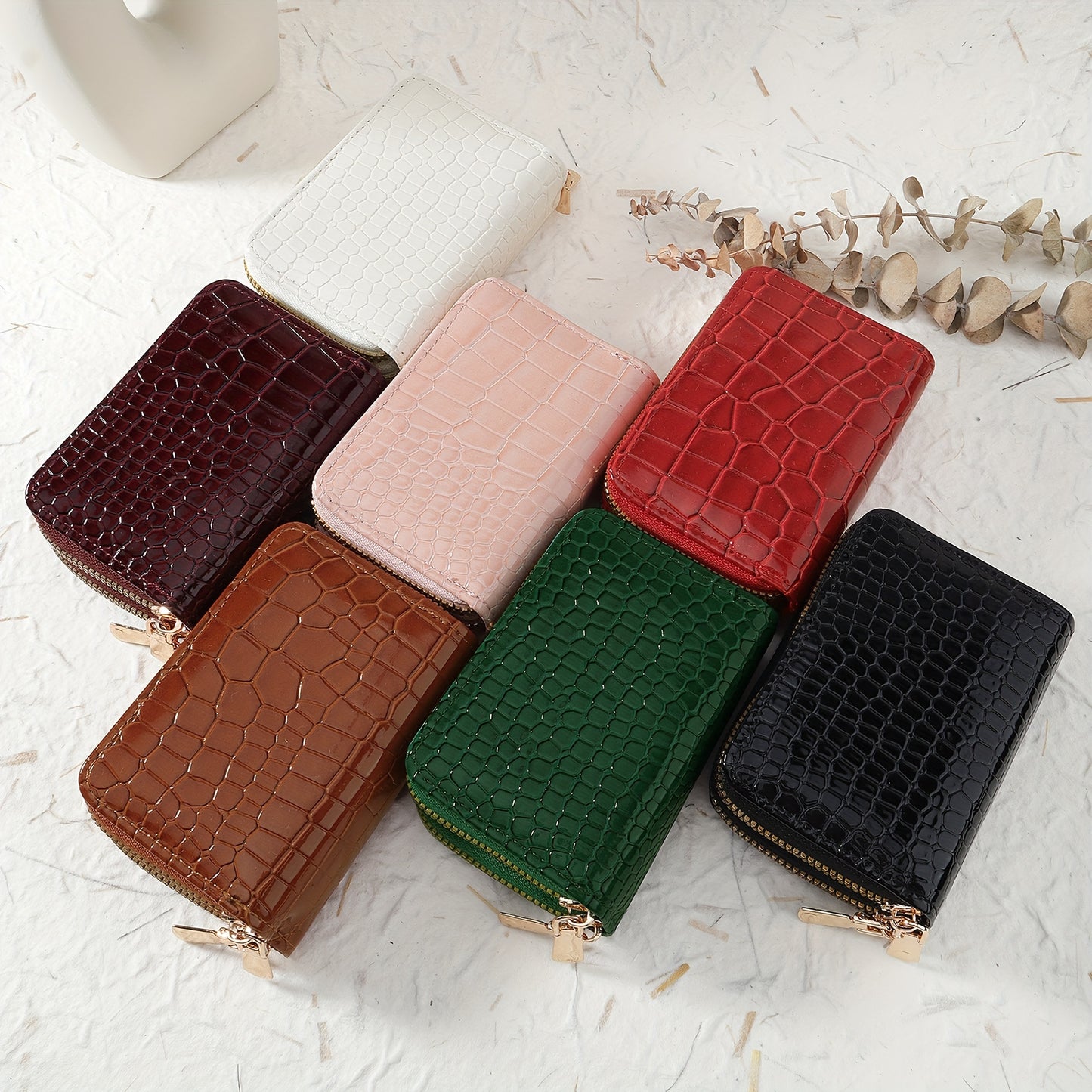 Women's crocodile pattern zipper wallet made of synthetic leather with double zipper, multi-card holder, available in green, white, pink, red, and black. Secure and stylish accessory.