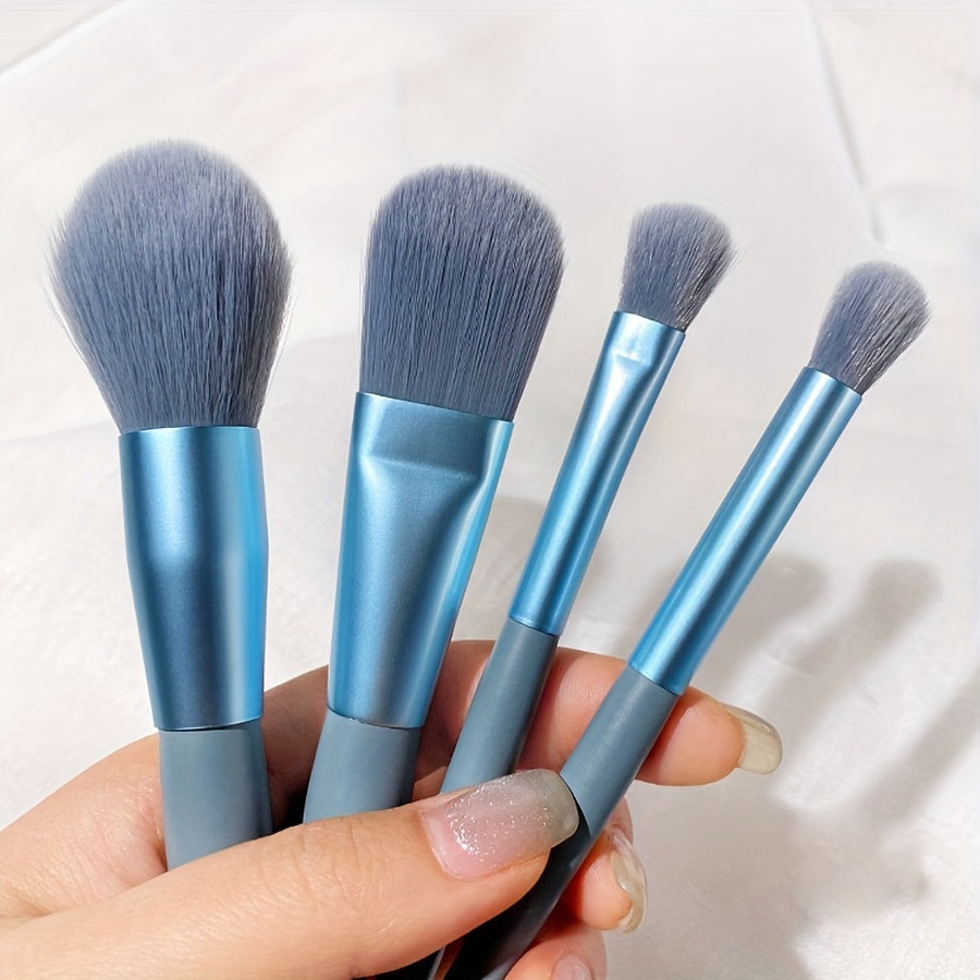 8 soft, portable facial makeup brushes in blue for entry-level beauty tools. Includes eyeshadow, nose shadow, blush, lip brush, eyelash comb, and travel powder brush. Ideal gift for beauty