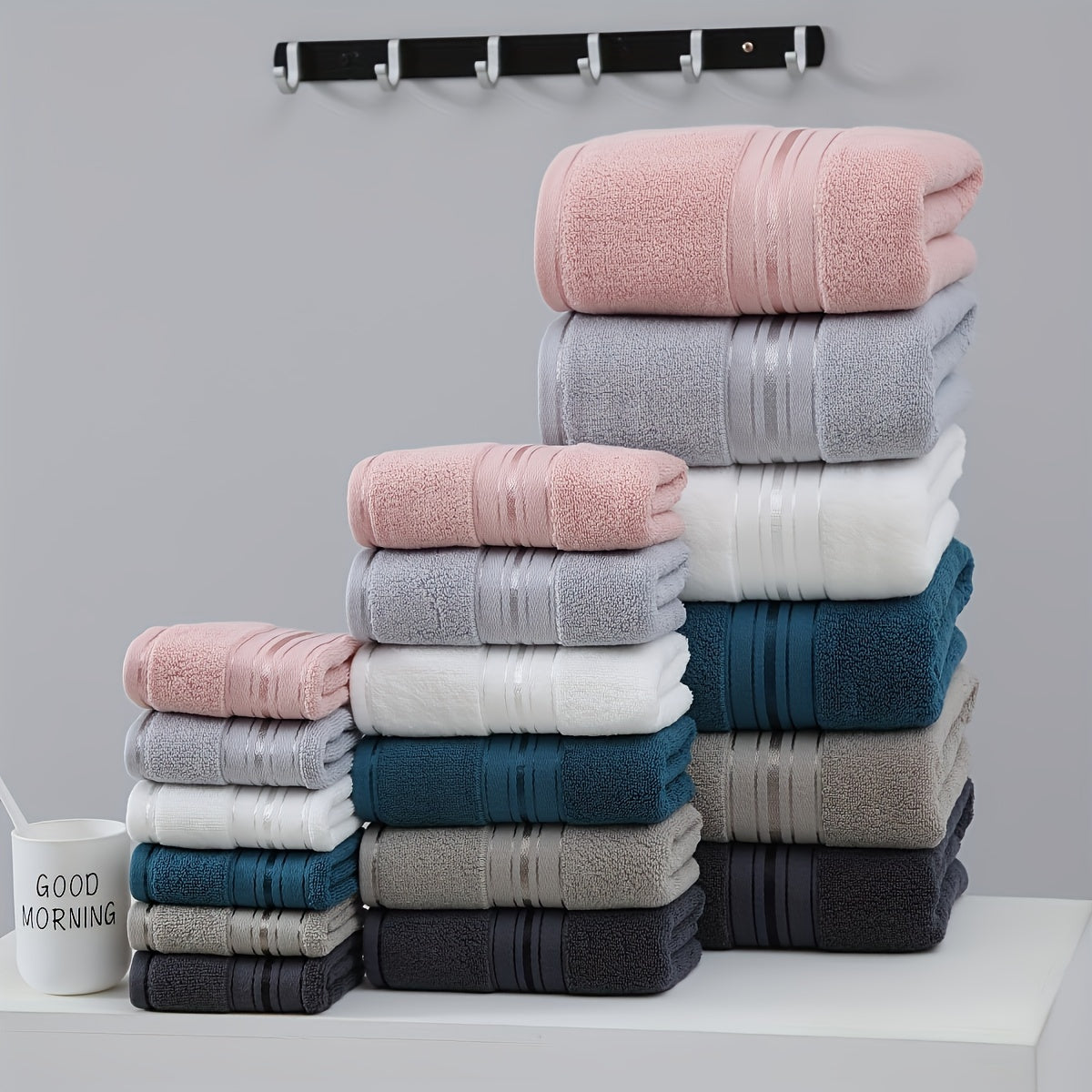 3-piece cotton towel set includes a washcloth, hand towel, and bath towel. Absorbent, quick-drying, super soft, and skin-friendly. Ideal for home bathroom use.