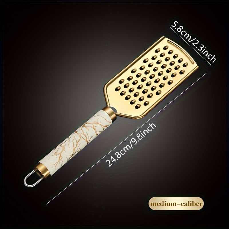 Stainless steel kitchen grater for shredding various foods, with a safe handle and luxurious golden appearance.