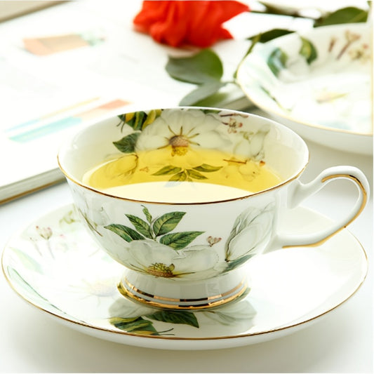 Vintage Bone Porcelain Tea Cup Set with Golden Trim and Flower Pattern, Elegant Table Decor.