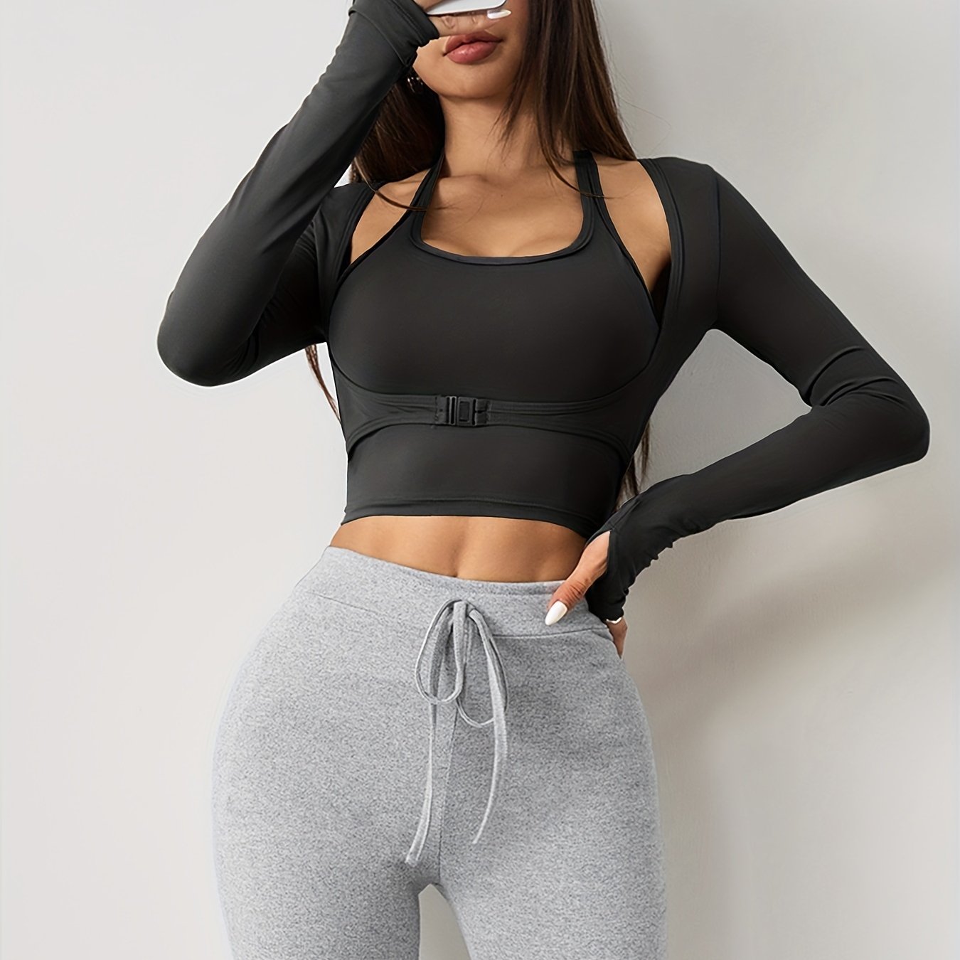 Women's long sleeve yoga top with built-in bra, seamless sports crop top for fall and winter seasons.