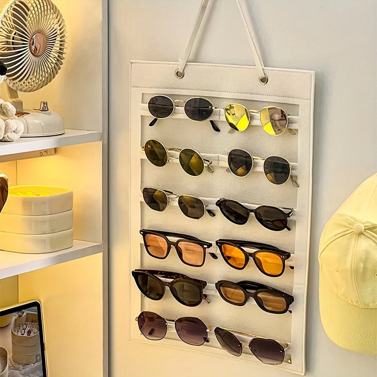 Organize your sunglasses with this hanging wall organizer featuring 12 slots made of felt. Keep your glasses dust-proof and easily accessible with this storage display pocket wall stand holder.