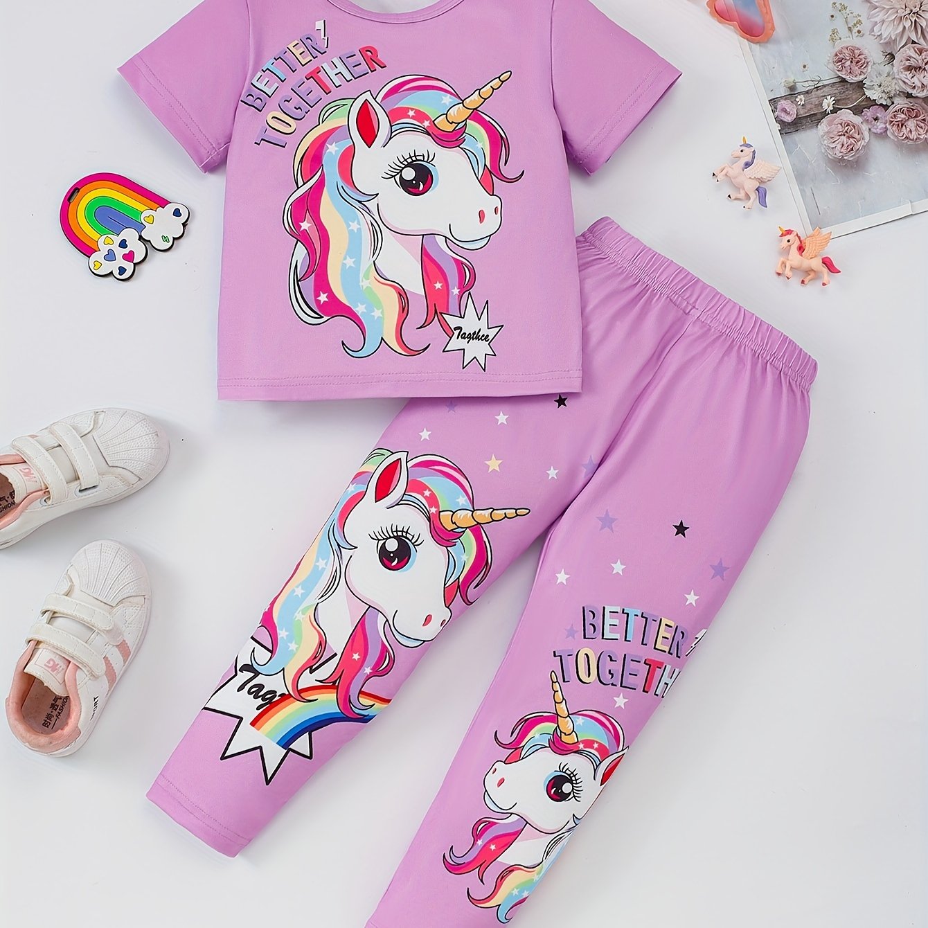 Girls' magical creature graphic t-shirt and jogger pants set. Casual outfit with animal print, regular fit, and medium stretch. Perfect for ages 3+ for outdoor activities.