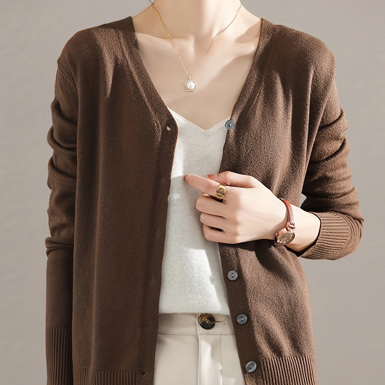 Chic V-neck cardigan with long sleeves, perfect for spring and fall.