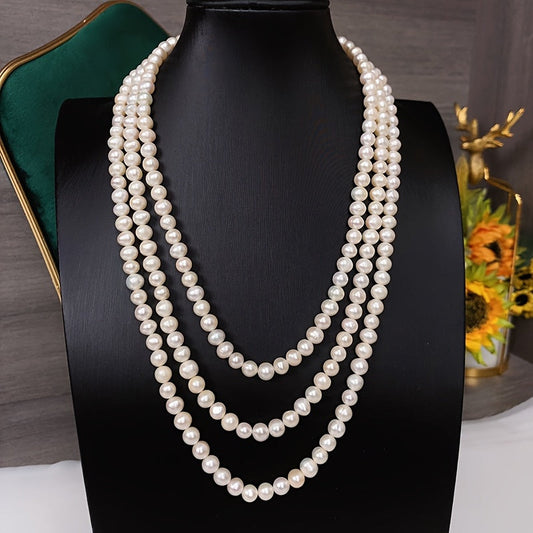 This French Vintage Three-Layer Freshwater Pearl Long Sweater Necklace is an exquisite gift for any lady. It is a versatile and elegant accessory that can be worn every day, adding a touch of fashion to any outfit. Perfect for celebrations, parties, and