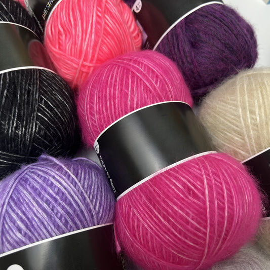 6 skeins of soft, skin-friendly blend yarn in assorted colors for hand knitting and crochet, made with nylon and acrylic fibers.