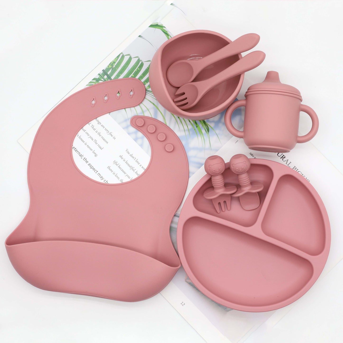 Set of 8 pieces of food grade silicone tableware including a feeding bib, plate, bowl, cup, silicone spoon, fork, and short spoon fork set. Perfect for gifting on Christmas, Halloween, Thanksgiving Day, New Year's, Valentine's Day, and Easter.