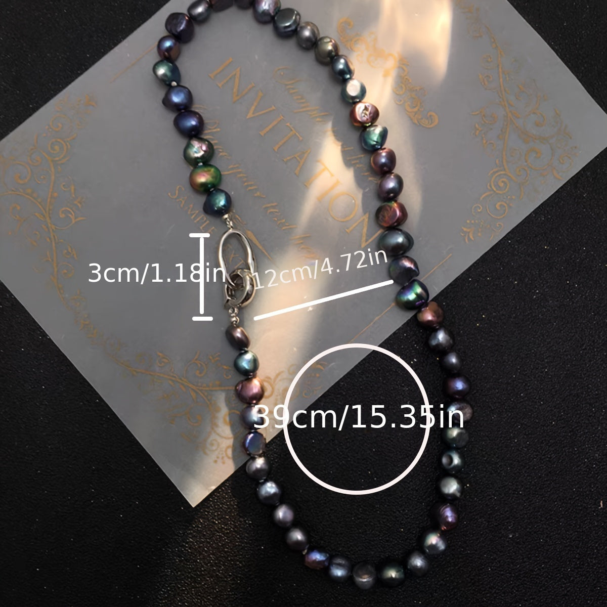 This necklace features a beautiful, natural freshwater cultured pearl measuring 7-9MM in a stunning blue-black hue. The clavicle length necklace is designed for women and showcases irregular baroque pearls with a unique texture and shape. Each pearl is