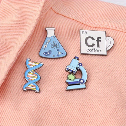 Set of 20 Enamel Science Brooches in Cartoon Academic Style, featuring Chemistry-themed badges including a Beaker, Microscope, DNA, and Alcohol Lamp. Perfect for adding a fun and unique touch to lab coats, bags, and clothing.