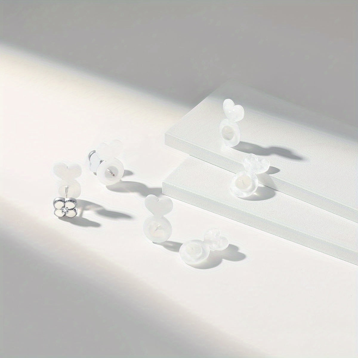 Silicone ear post backs provide invisible support for heavy earrings, preventing earlobes from drooping. This safe solution is ideal for studs and pendants.