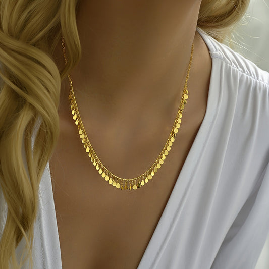 This exquisite, vintage-inspired necklace features golden sequins, perfect for adding a touch of elegance to any outfit. Whether you're dressing up a casual look or searching for the perfect gift, the small round sequins are both versatile and chic.