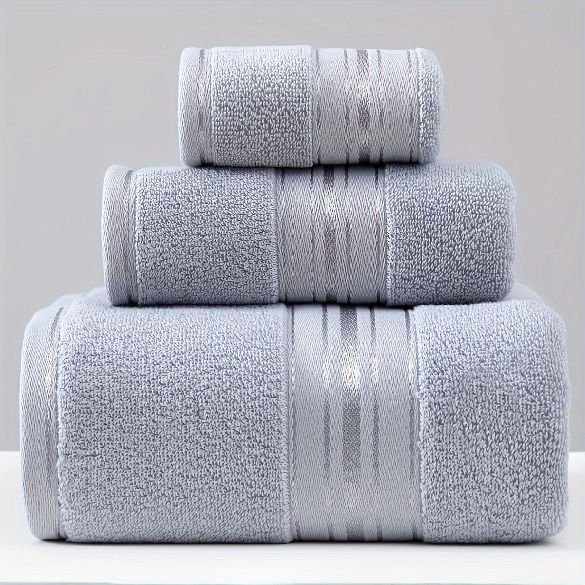 3-piece cotton towel set includes a washcloth, hand towel, and bath towel. Absorbent, quick-drying, super soft, and skin-friendly. Ideal for home bathroom use.