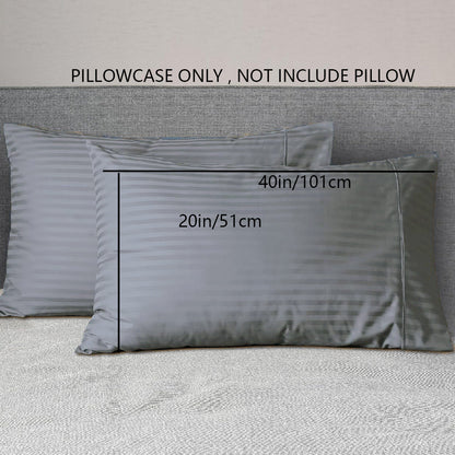 A pair of striped pillowcases made from soft, breathable woven polyester. These pillowcases are machine washable and have a sanded finish for added comfort. They do not include a pillow insert and are made from non-printed lightweight fabric with a 90gsm