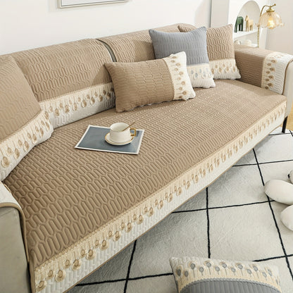 Luxurious Feather Embroidery Quilted Sofa Cover enhances and protects your couch.