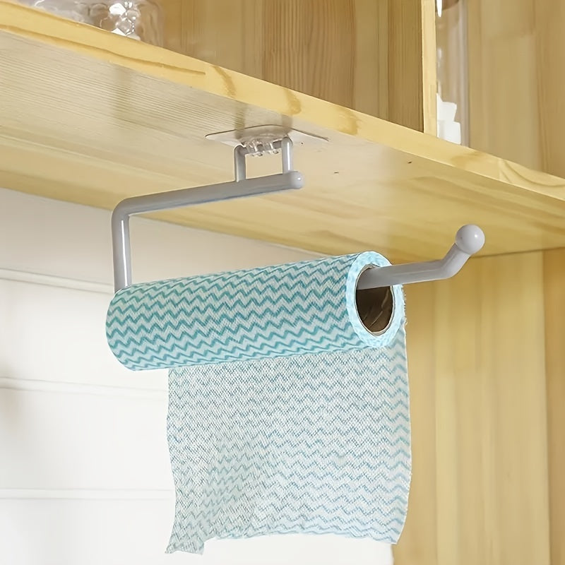 Wall mount kitchen paper towel holder made of plastic - also serves as a dispenser for toilet rolls, storage rack for cling film, and organizer for rags. This space-saving bathroom accessory is versatile and practical.