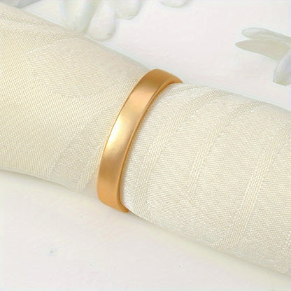 6 golden stainless steel napkin rings for elegant table decor during Christmas and special occasions.