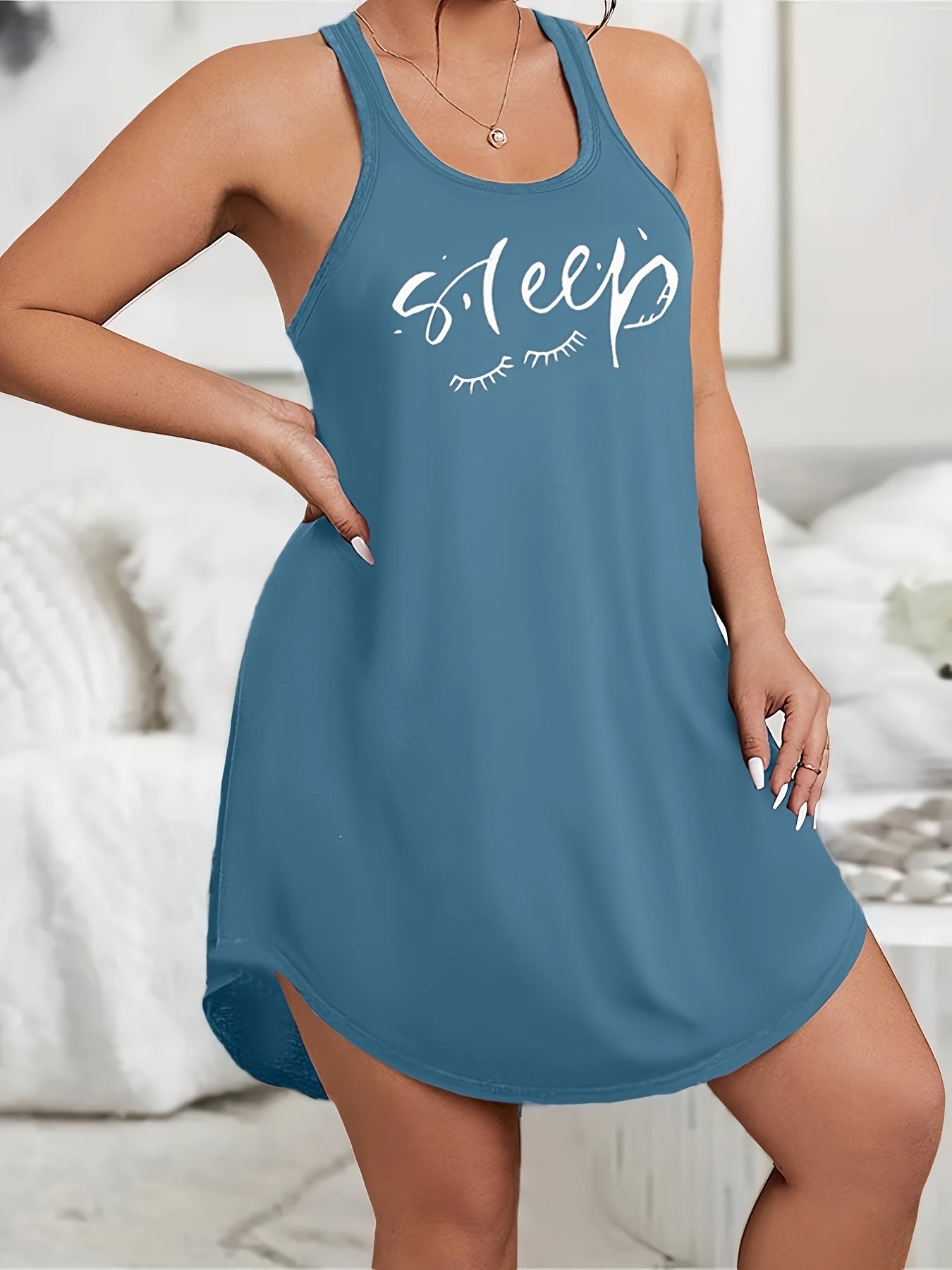 Plus size loungewear dress with scoop neck and racer back, featuring eyelash and letter print.