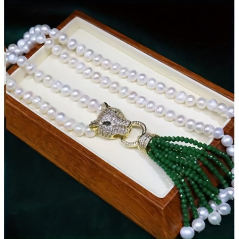 A classic Y-necklace featuring freshwater pearls and a stylish leopard clasp - perfect for adding a touch of elegance to any outfit. This versatile piece is great for weddings, banquets, music festivals, vacations, and the autumn season. It also makes a