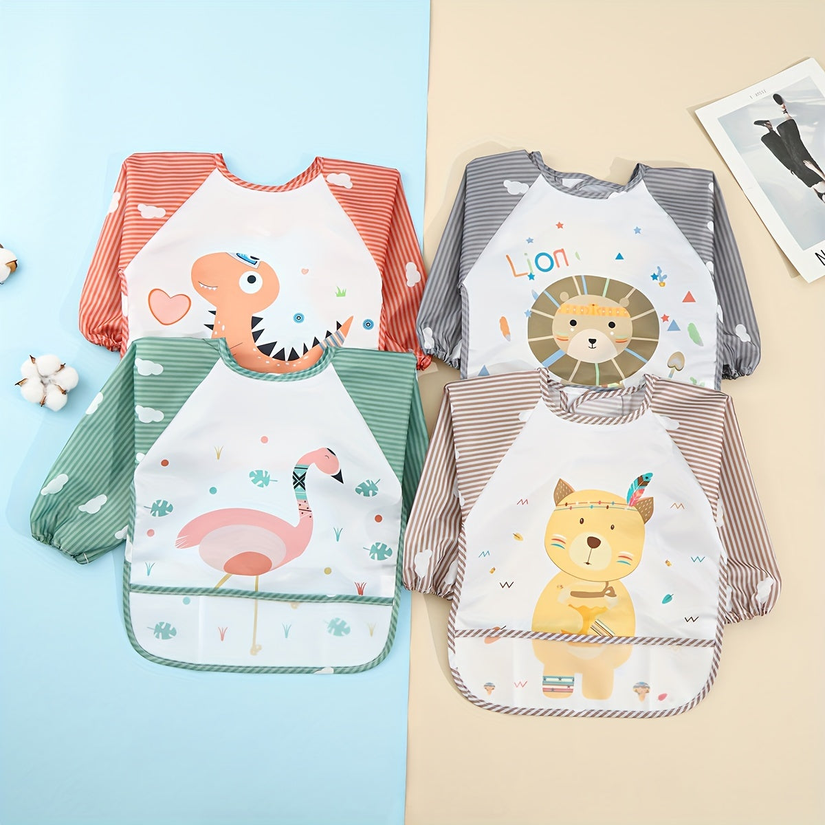 Easily cleanable reverse wear cartoon bib with waterproof long sleeves, suitable for home and travel.