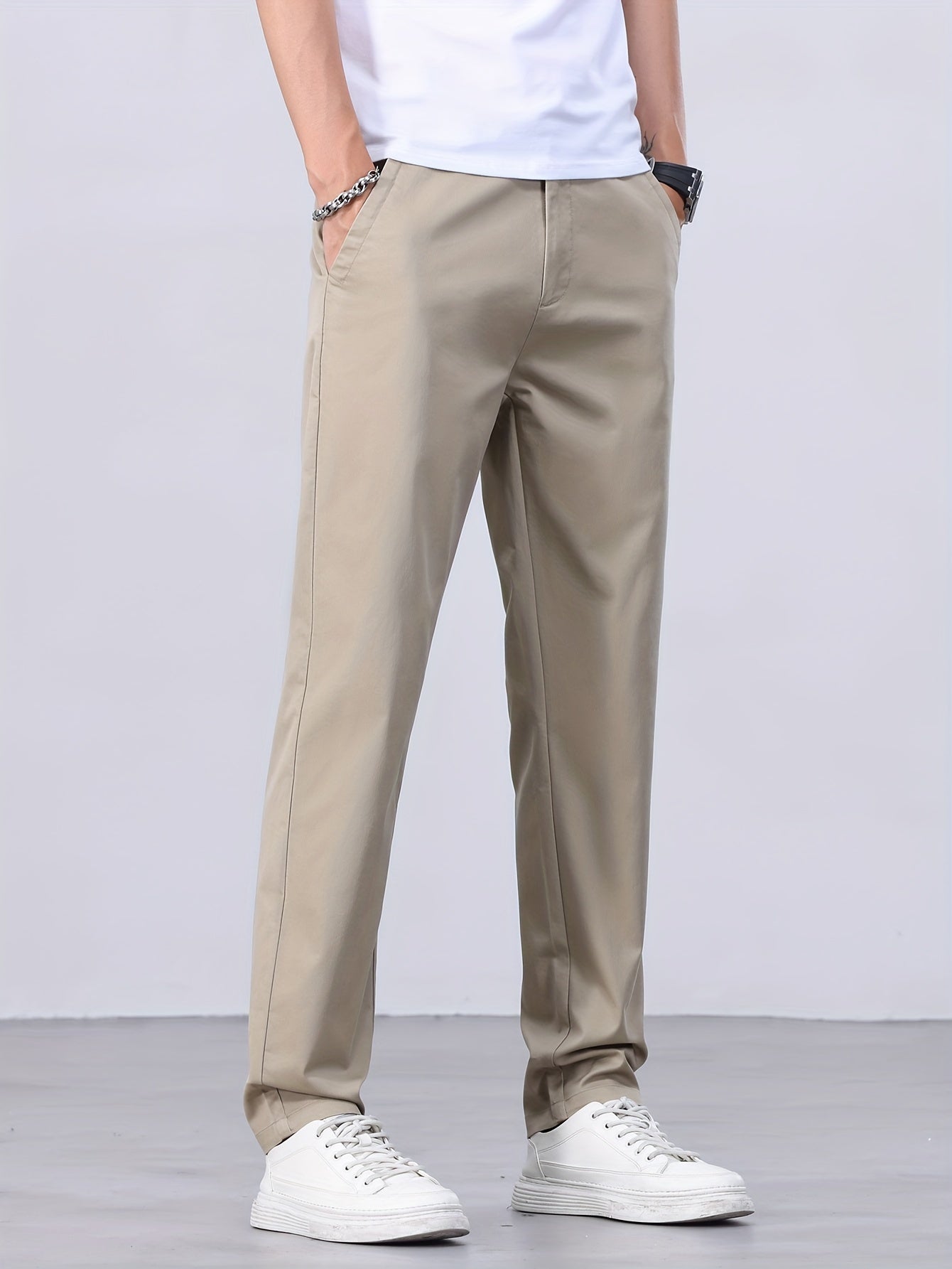 1 Men's all-season casual pants in caramel color, made of cotton blend with slight stretch and regular fit, featuring mid waist, pockets, zipper fly, and woven work style for weekend casual.