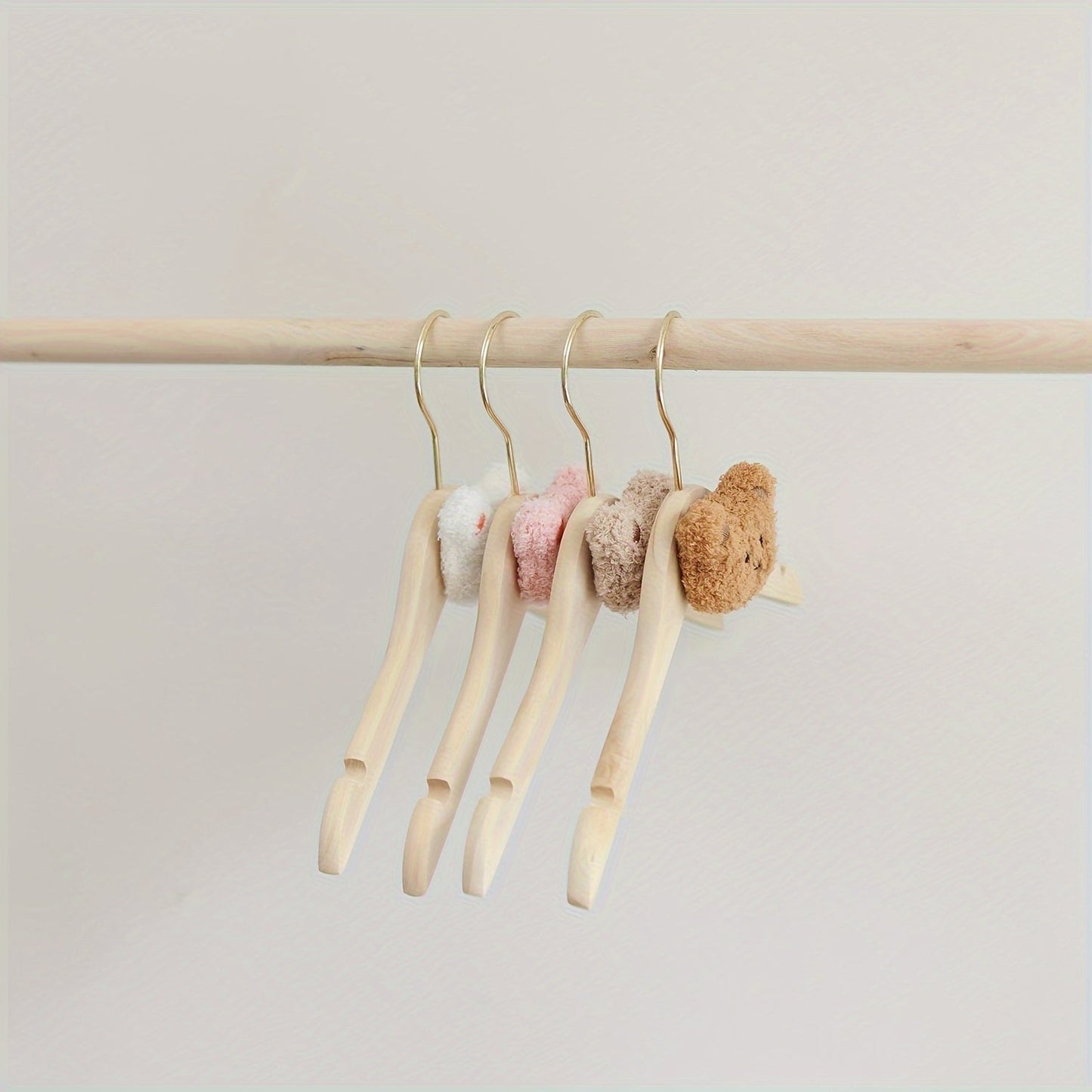 Durable and Lightweight Wooden Clothes Hangers featuring a Nordic Style Cartoon Bear Design, with Swivel Hooks for easy maneuvering. Recommended for Ages 14 and up.