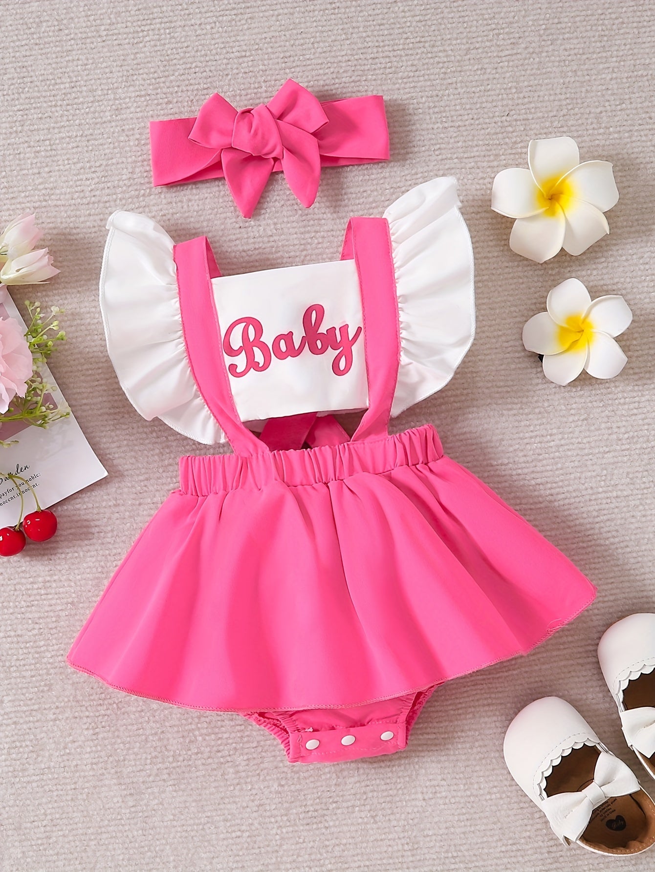 Sweet baby romper dress with cute color contrast letter print and flying sleeves.