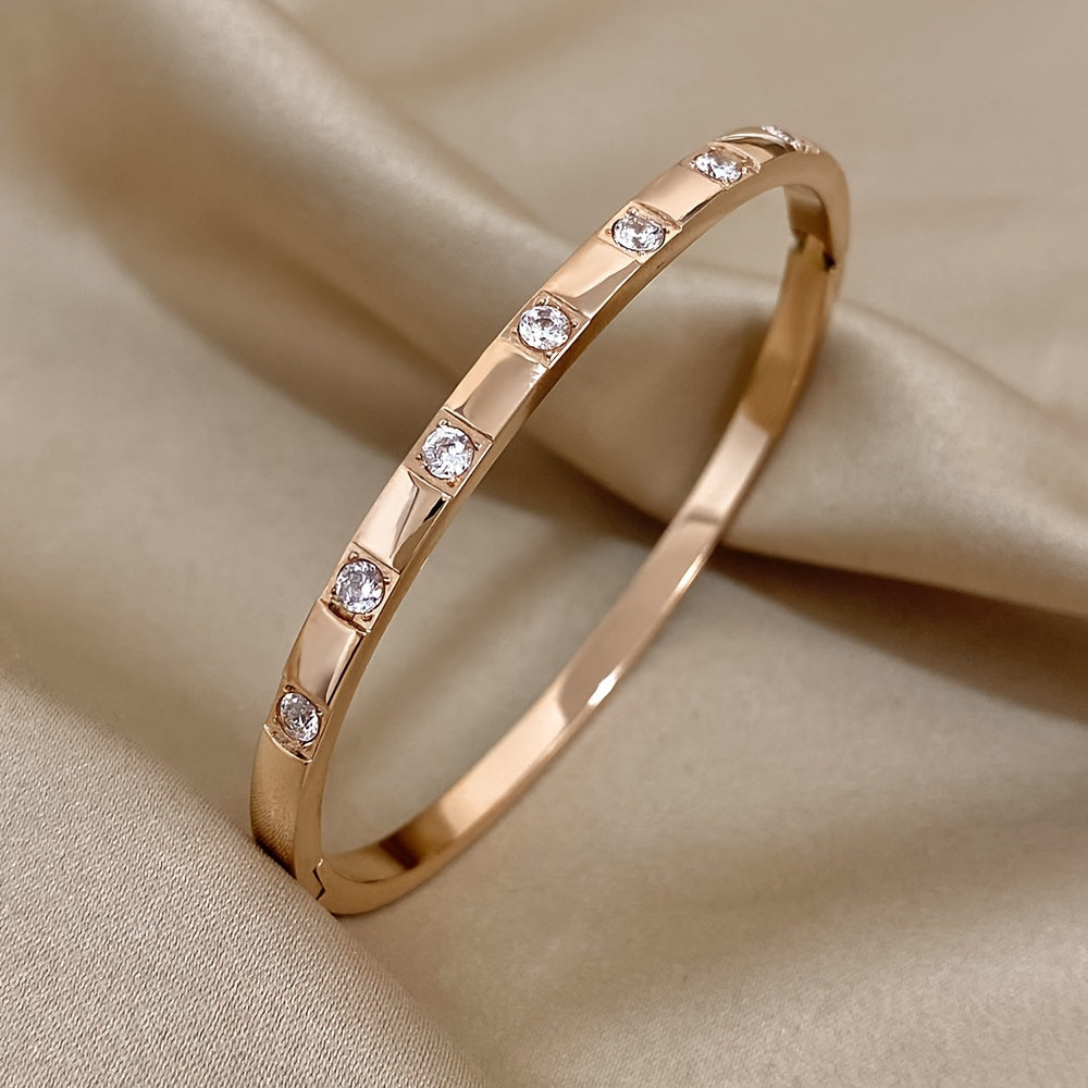 This exquisite rose gold stainless steel bracelet with sparkling rhinestones makes a stunning and opulent gift for your family, loved ones, and friends.