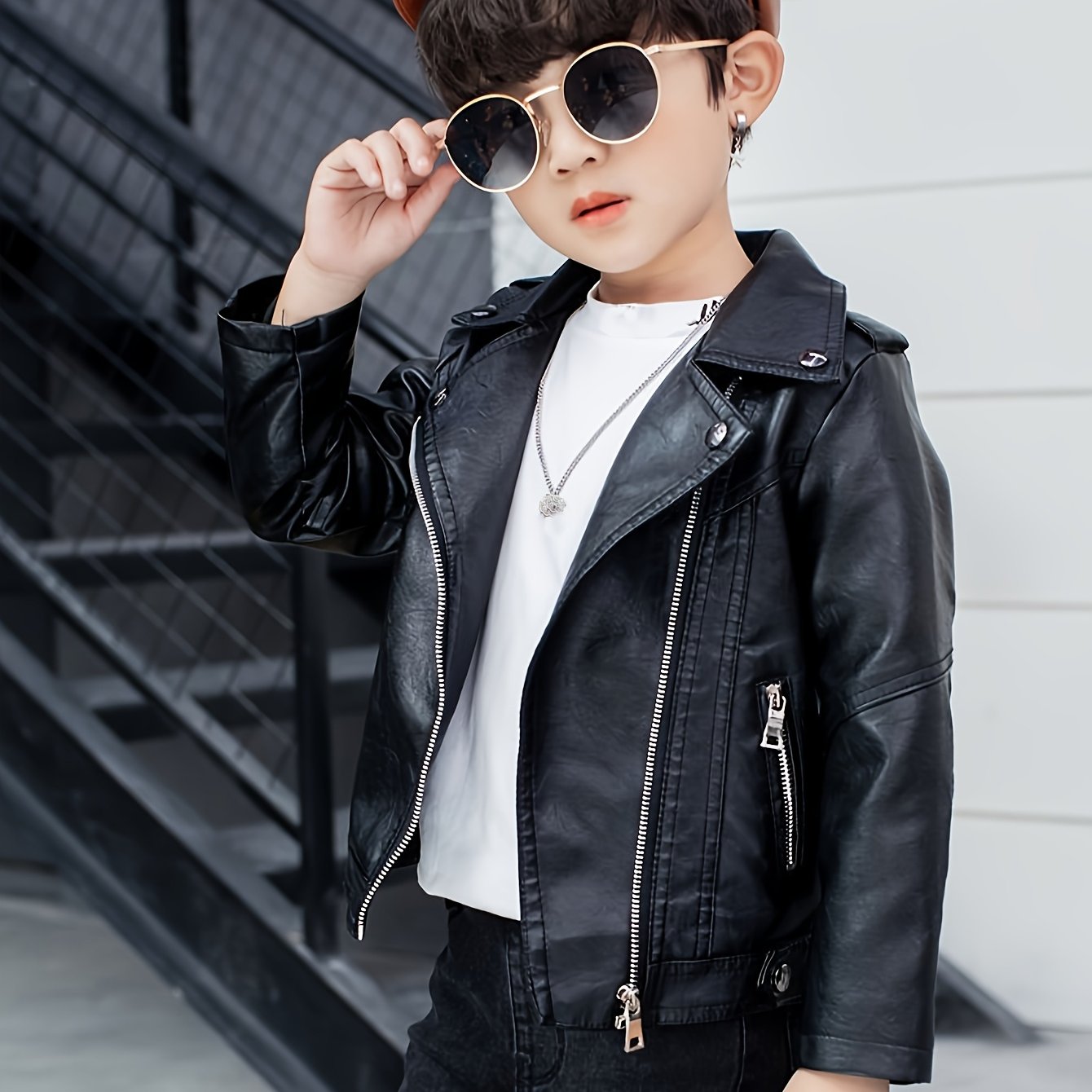 Kids' loose fit polyester jacket with lapel collar, solid color, long sleeves, and zipper detail. Suitable for all seasons.