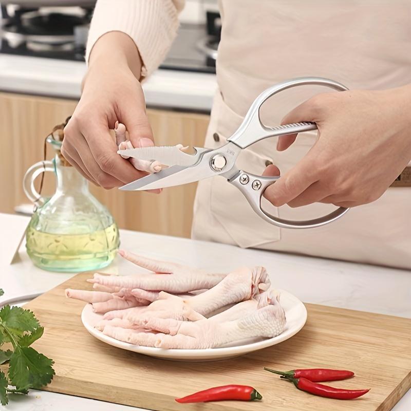 Durable and comfortable, these versatile stainless steel kitchen scissors with an ergonomic handle are perfect for cutting chicken bones, meat, fish, vegetables, and more. The super sharp blades make cooking and dining tasks a breeze.